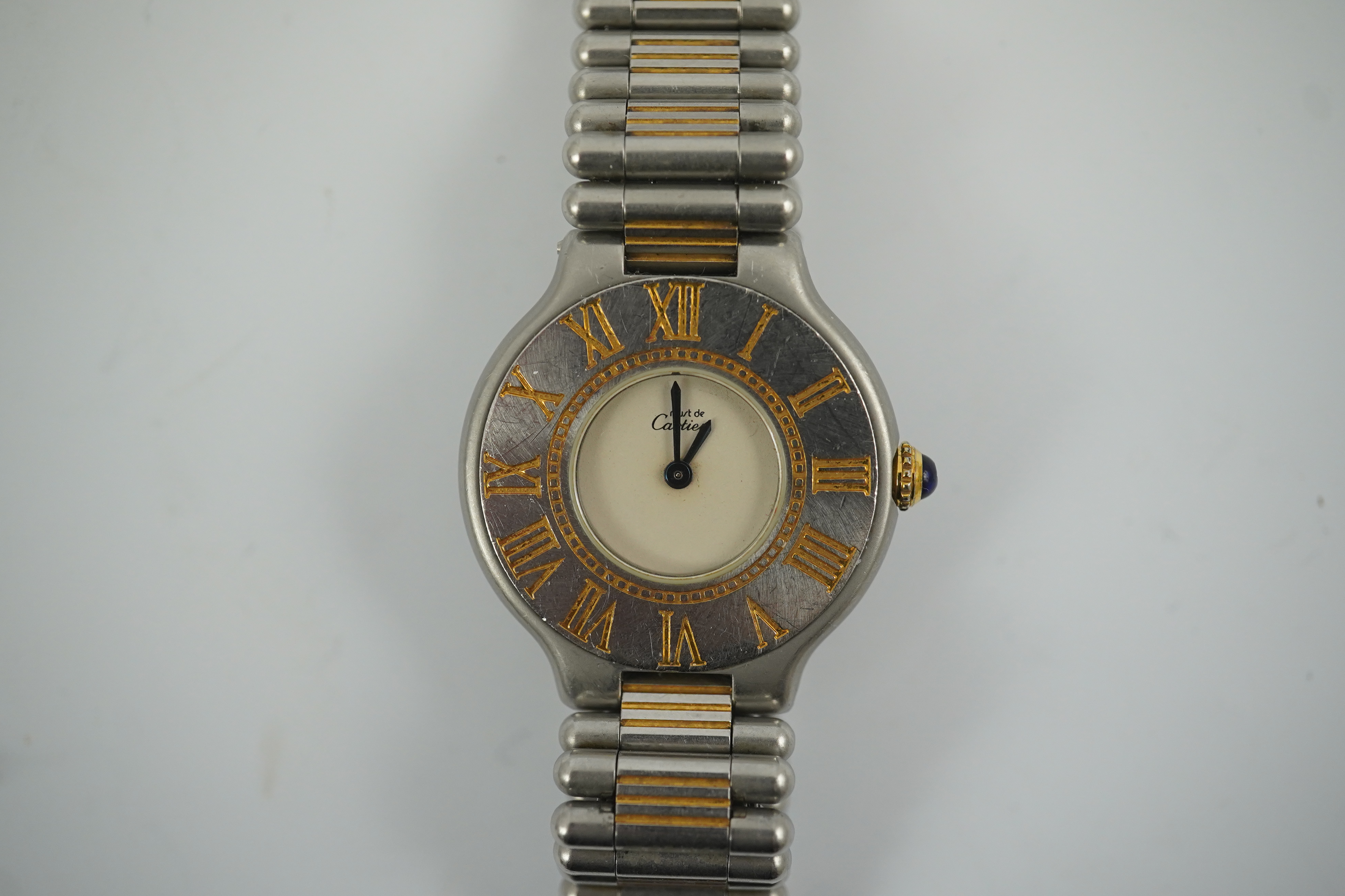 A lady's steel and gold plated Must De Cartier quartz wrist watch, on a steel and gold plated Must De Cartier bracelet